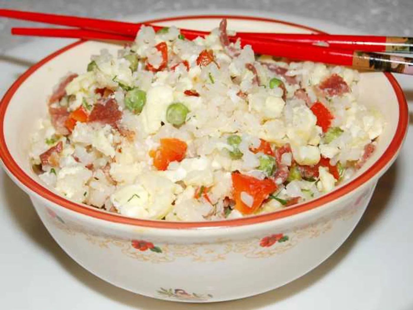 Fried rice with egg, meat and vegetables in Chinese recipe