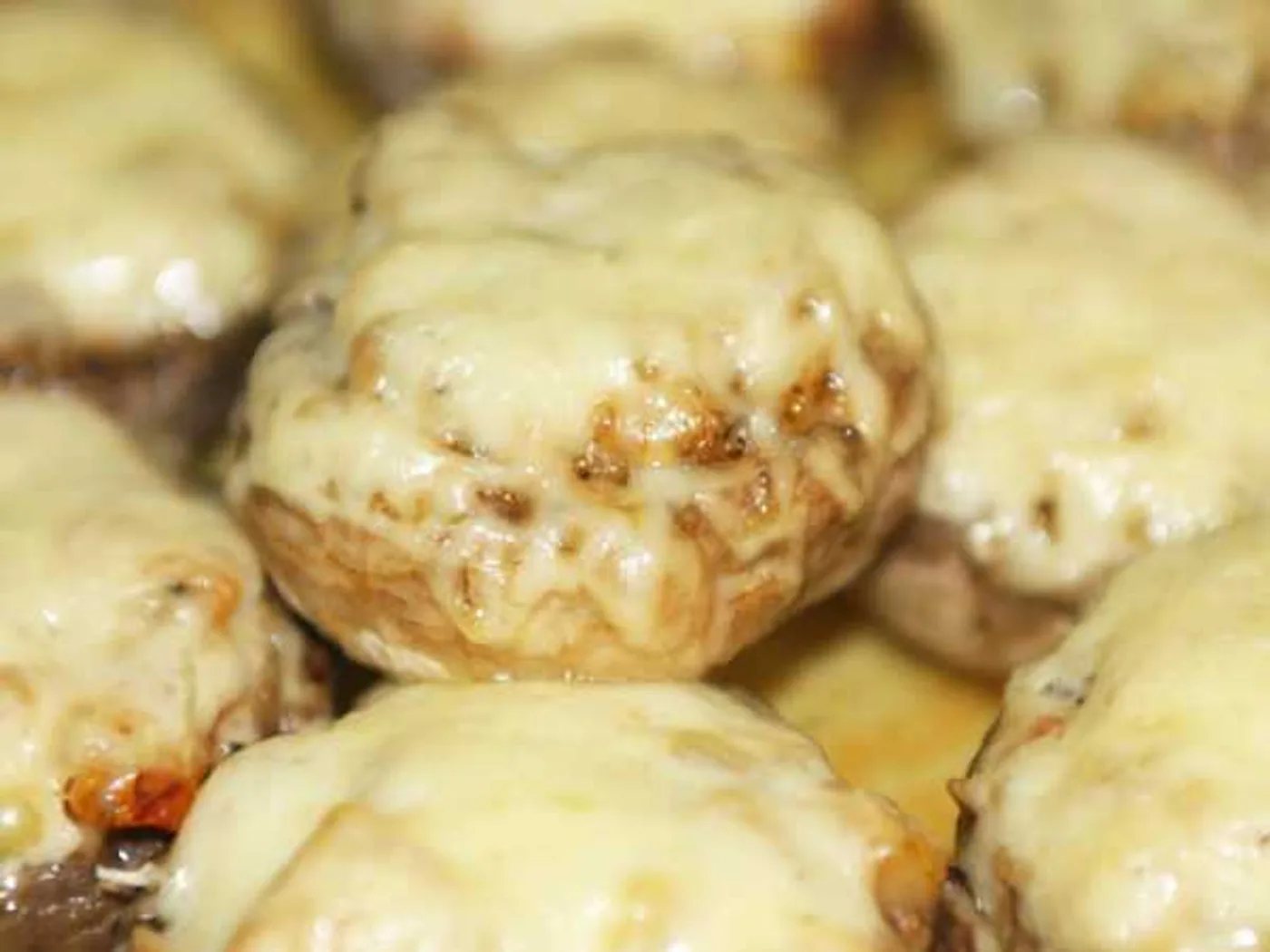 Champignons stuffed with tomatoes and cheese recipe