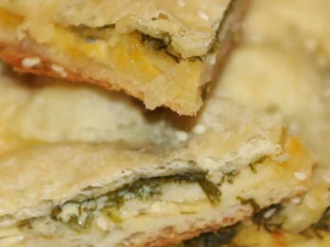 Onion cake made of puff pastry with cheese recipe