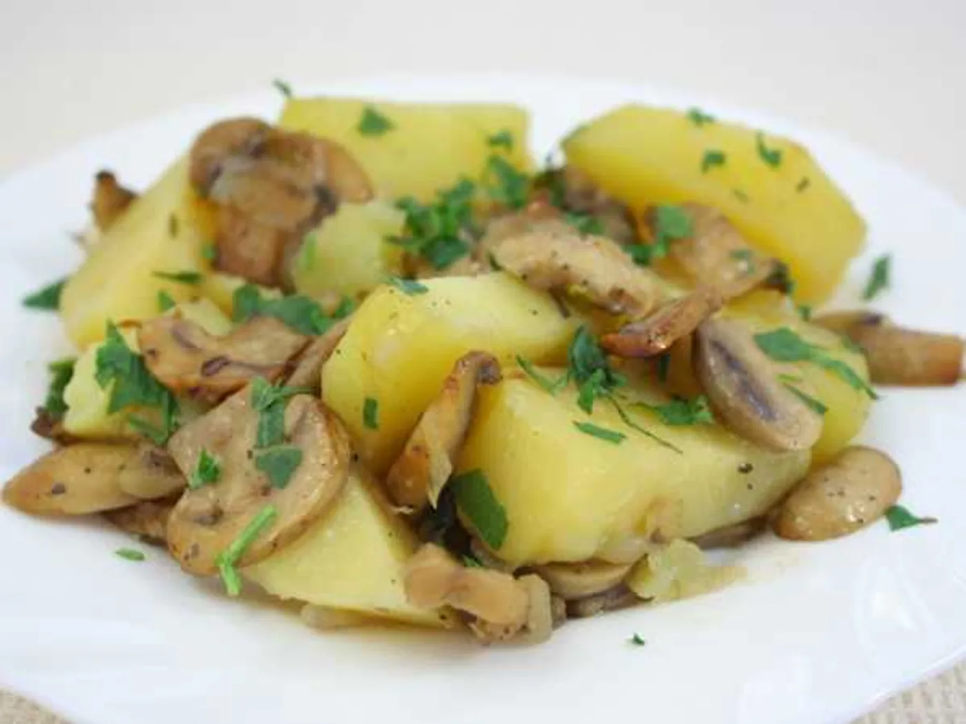 Potatoes baked with mushrooms in the oven recipe